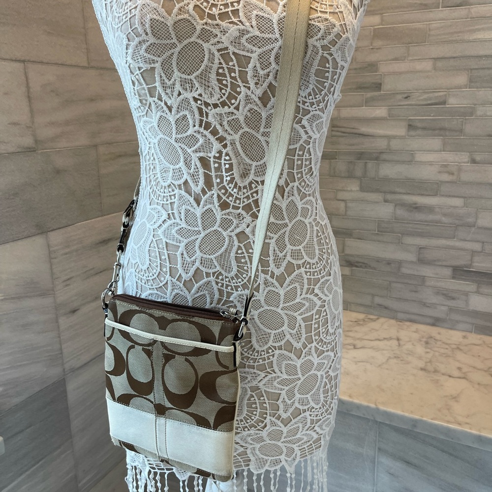COACH SIGNATURE crossbody bag w/Coach logo. Inside and outside pockets.